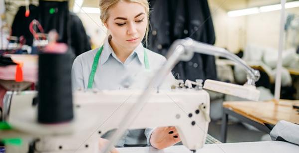 a woman using a sewing machine